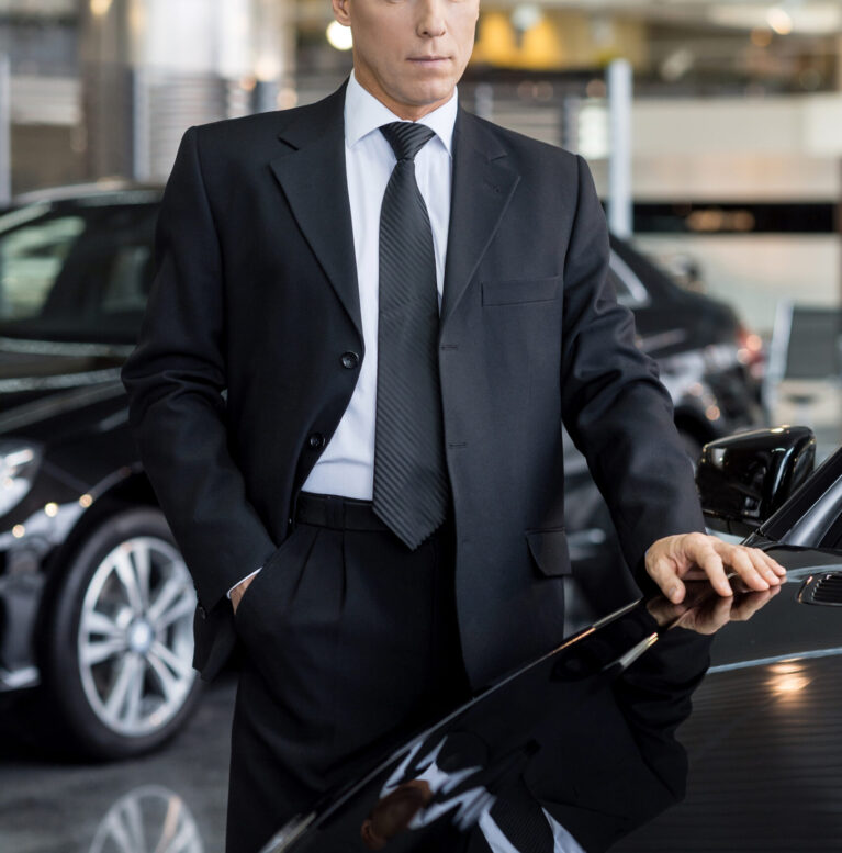 This is what I want. Mature grey hair businessman choosing a new car